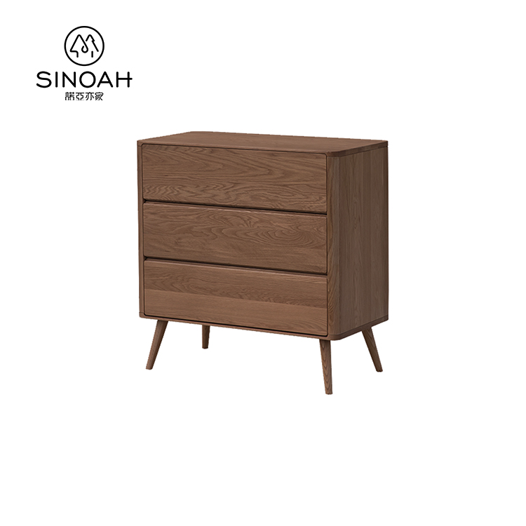 یک کابینت سه کشوی بلوط تیره راه حل مناسبی برای ذخیره سازی خانه های مدرن است